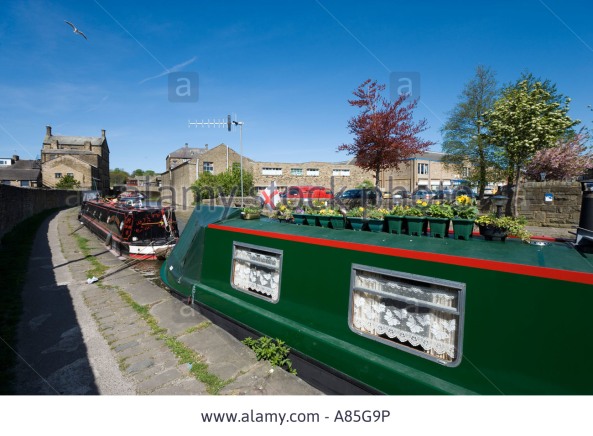 narrowboat with curtains and flower pots
